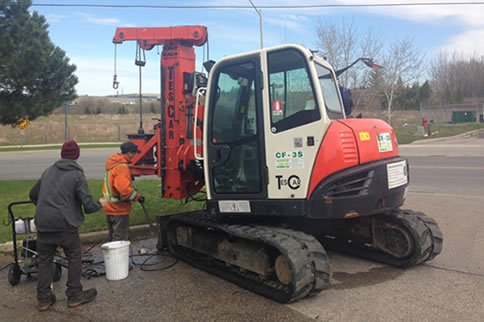 Field technicians servicing drilling equipment outdoors